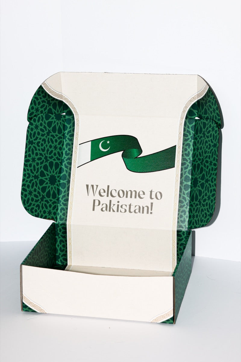 The inside lid of a Root Crate with the Pakistani flag and the words Welcome to Pakistan