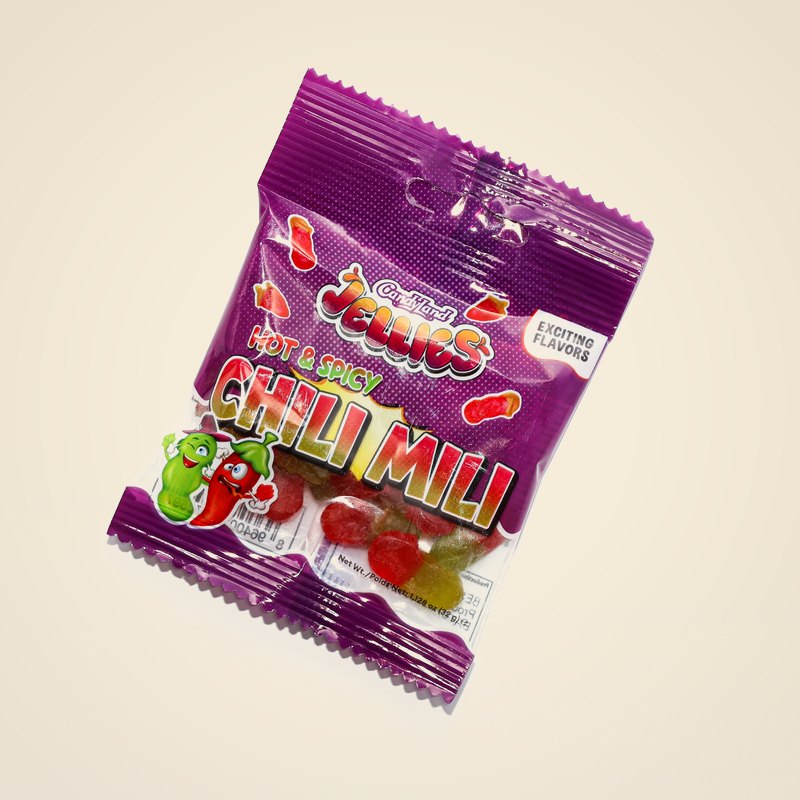 A bag of Chili Mili fruity jelly candies against a warm cream background.