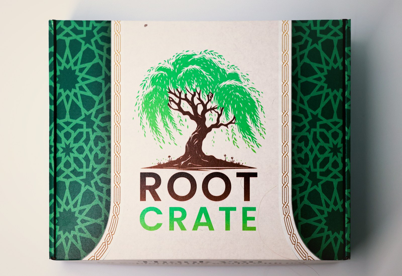 The closed Root Crate box: green and cream, featuring a willow tree and the Root Crate wordmark.