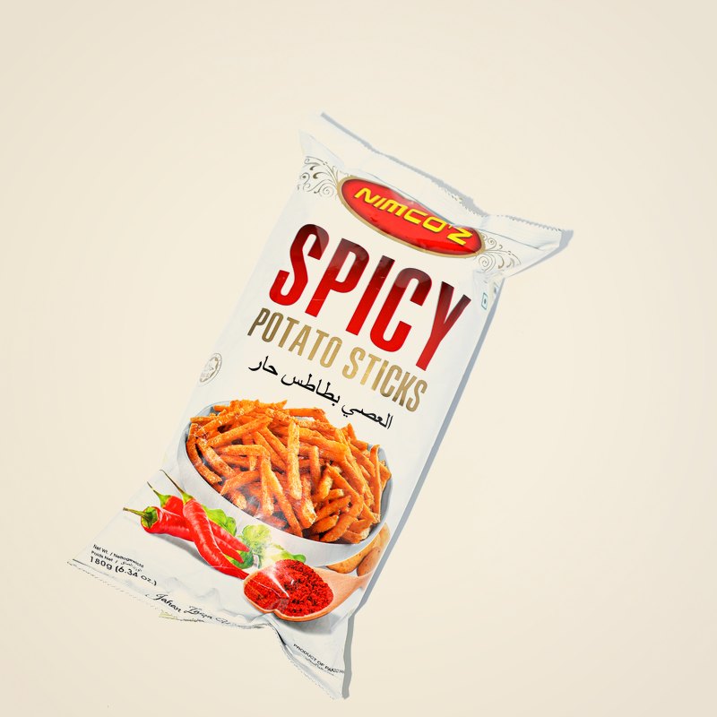 A packet of Nimco Spicy Potato Sticks against a warm cream background.